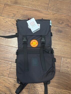Topo Designs Black Roll-Top Backpack with 25th Anniversary Patch
